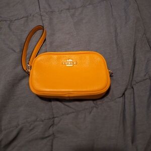 Orange Coach wristlet